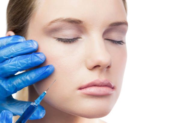 Client receiving cheek filler at Divaa Beauty