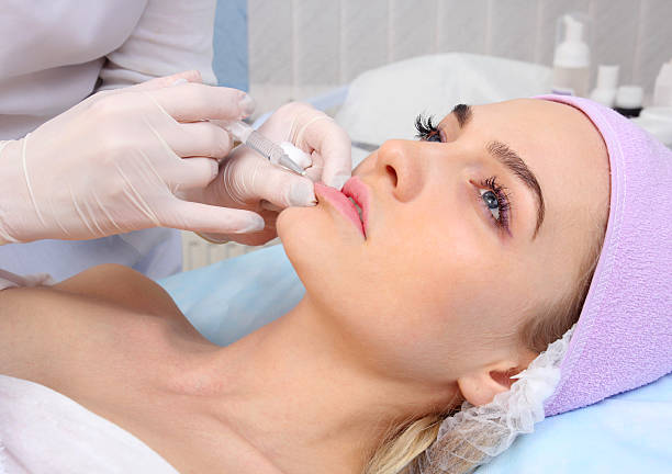 Client receiving Lip Filler at Divaa Beauty