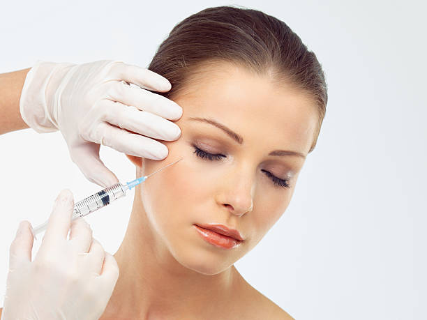 Client receiving under-eye filler at Divaa Beauty
